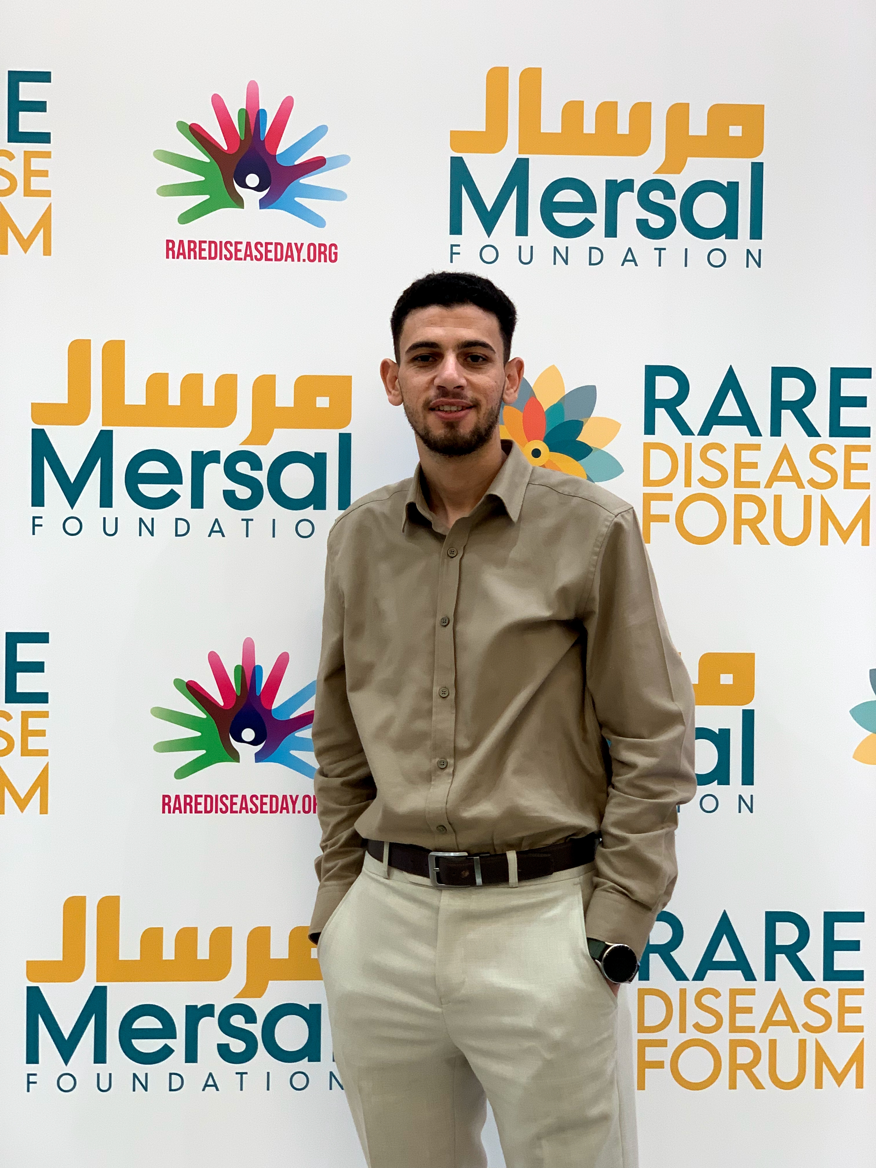 Omar working with the data team at Mersal Foundation